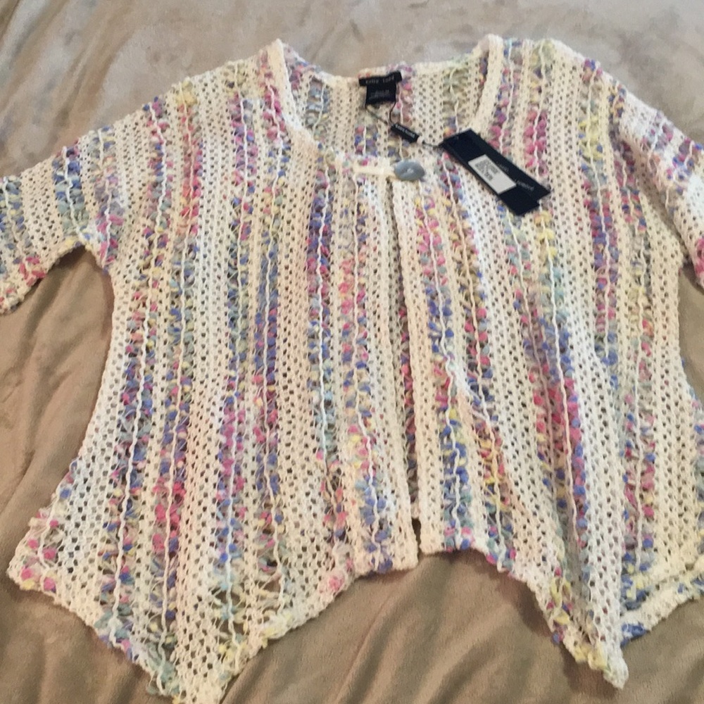 White with pastel sweater